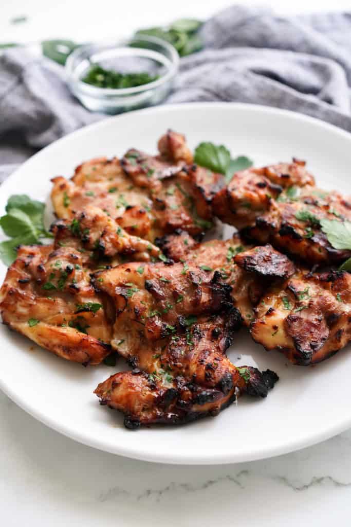 Pieces of teriyaki chicken thighs on a plate