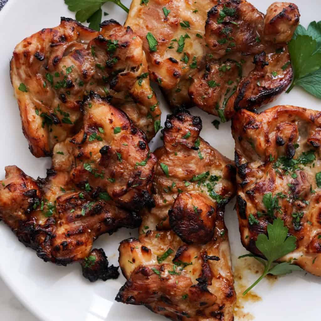 Charred teriyaki chicken on a plate