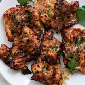 Charred teriyaki chicken on a plate