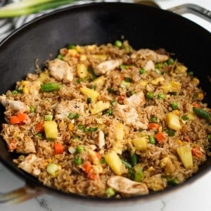 Fried rice with pineapple in a large skillet