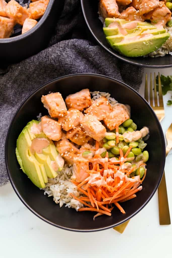 Air fryer salmon bowl with avocados, carrots edamame and rice