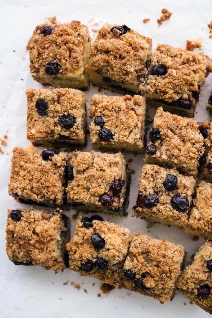 Slices of blueberry coffee cake topped with crumb topping