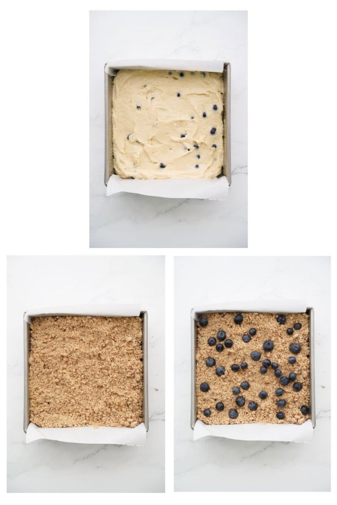 Blueberry coffee cake mixture in a square baking pan, topped with crumble, and then more blueberries