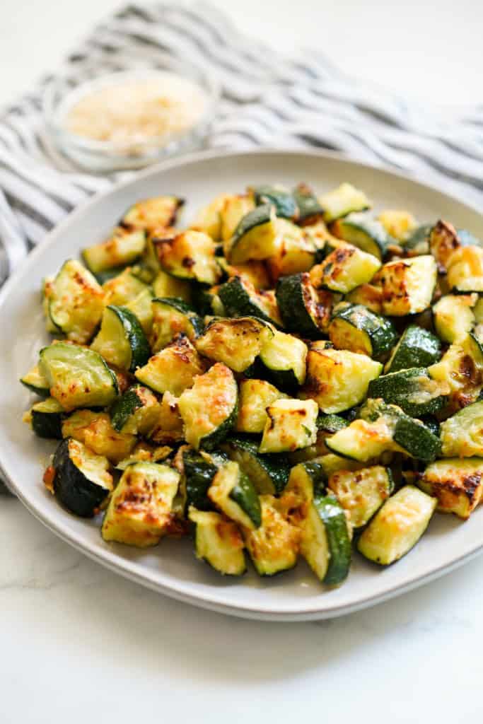 A plate of zucchini that is air fried until crispy.