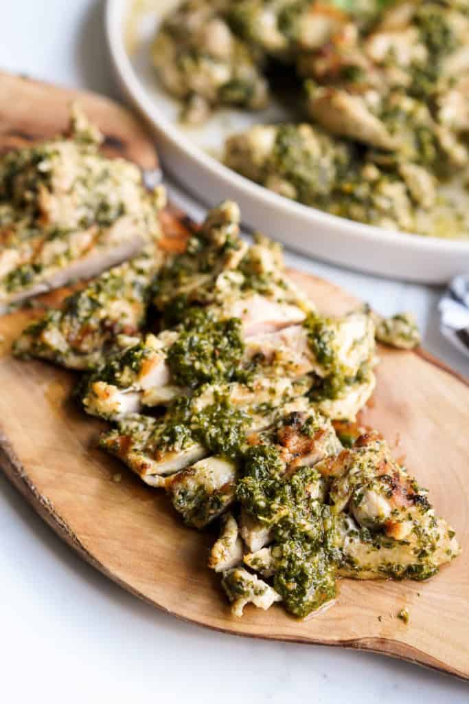 Sliced chicken strips marinated in chimichurri marinade and topped with more chimichurri sauce