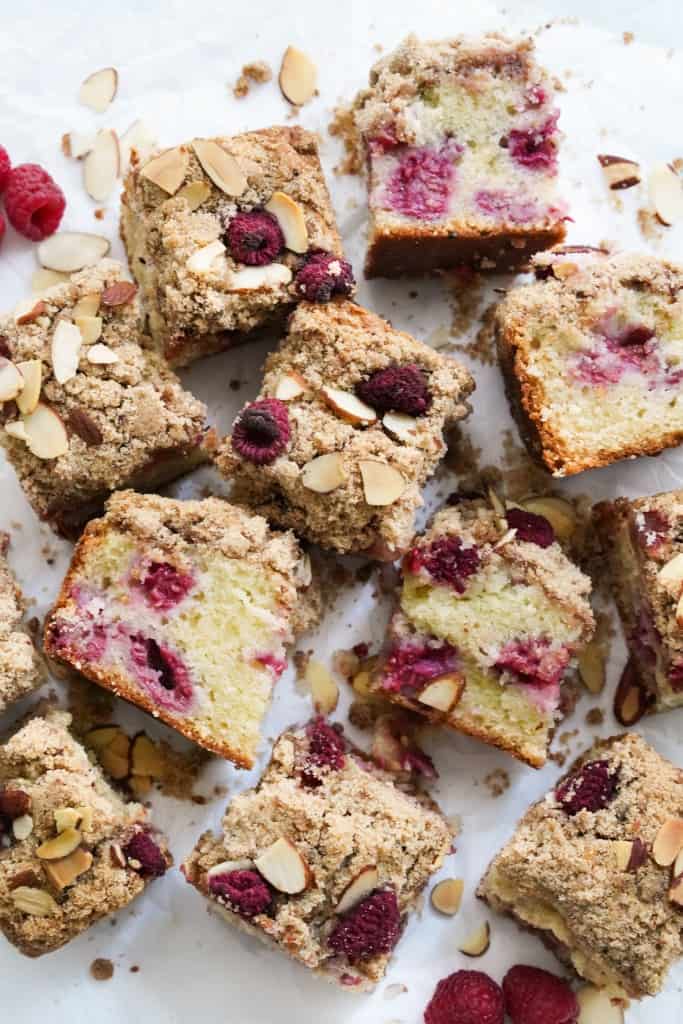 Small square slices of raspberry coffee cake with crumb topping