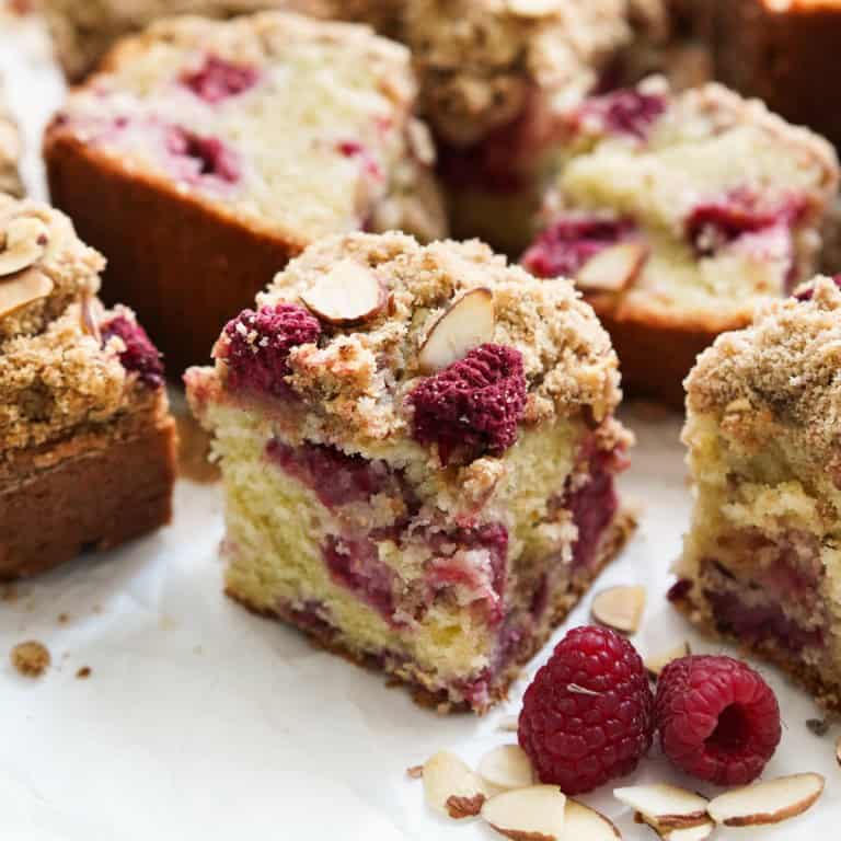 Small square slice of raspberry coffee cake with crumble topping