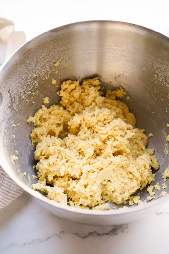 A mixing bowl with the cake mix base layer