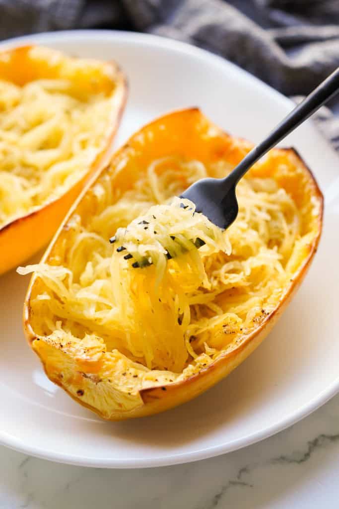 Lifting up strands of spaghetti squash