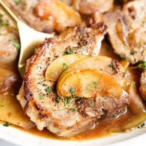 Pork chop topped with cooked sliced apples