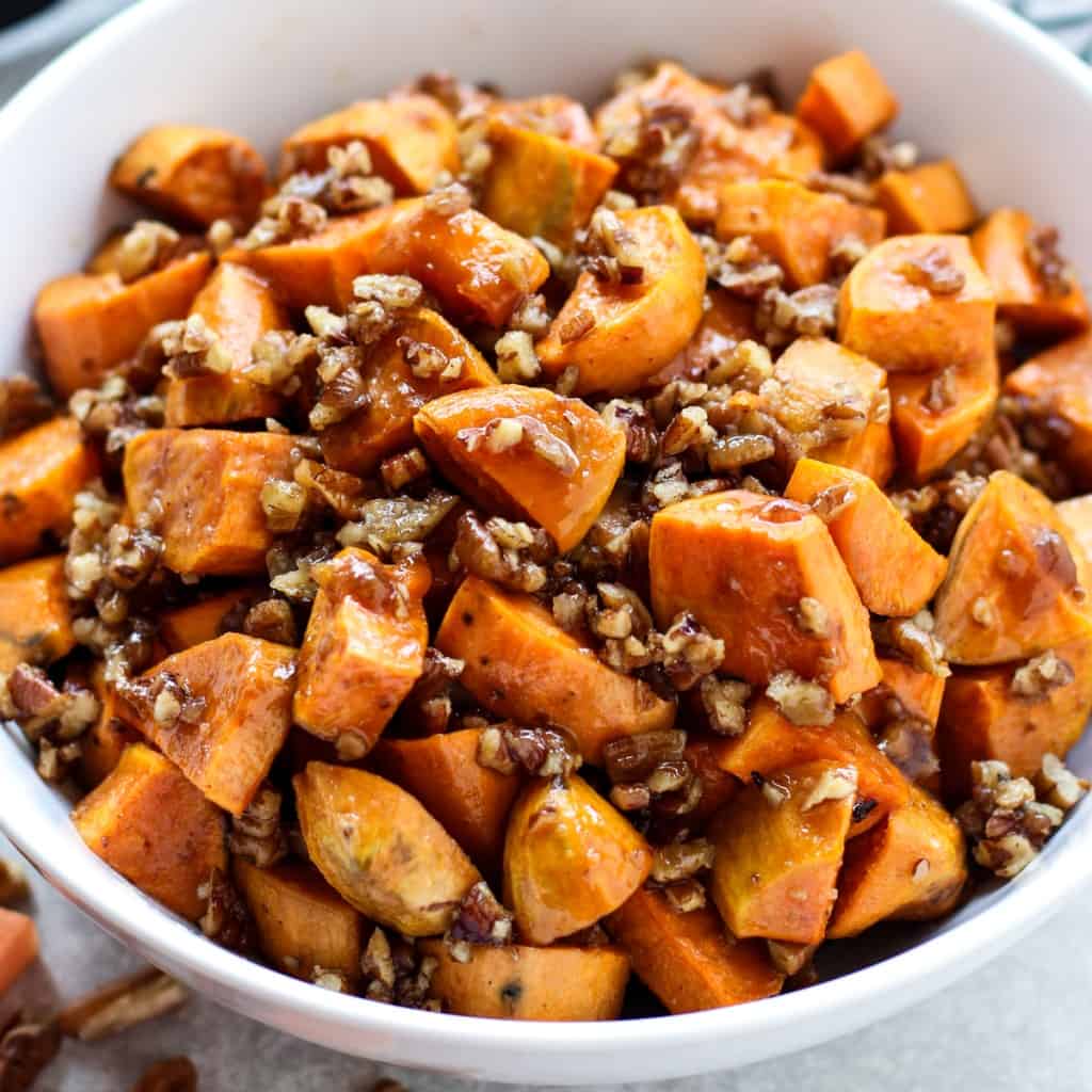 Caramelized sweet potato pieces tossed with chopped pecans