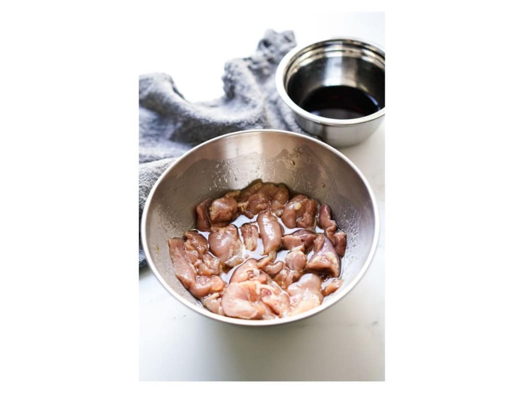 Marinating chicken thighs in teriyaki sauce