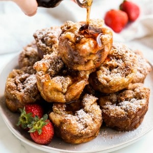 Maple syrup being drizzled onto French toast muffins