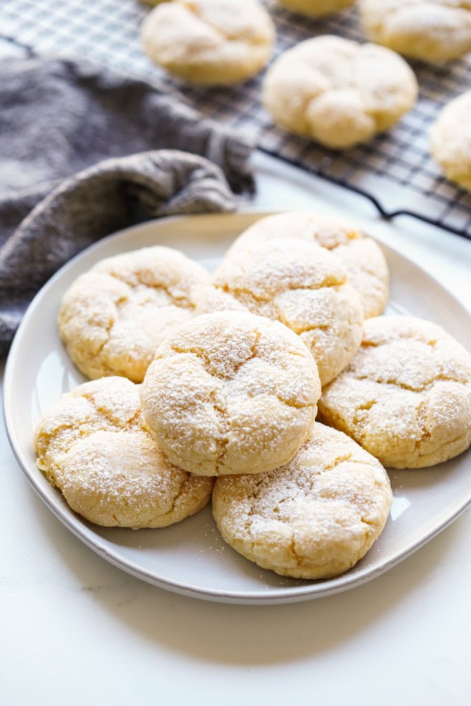A plate of gooey butter cookie topped with powdered sugar