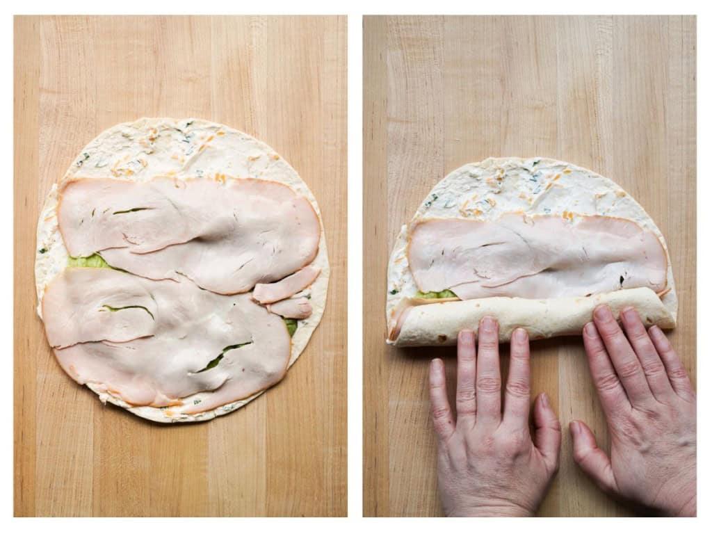 Turkey is placed on the tortilla with cream cheese spread, then tortilla is being rolled up