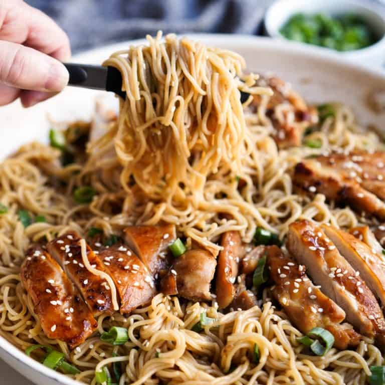 Picking up ramen noodles from a skillet