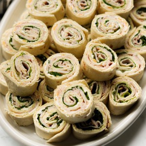A stack of turkey and cheese pinwheels