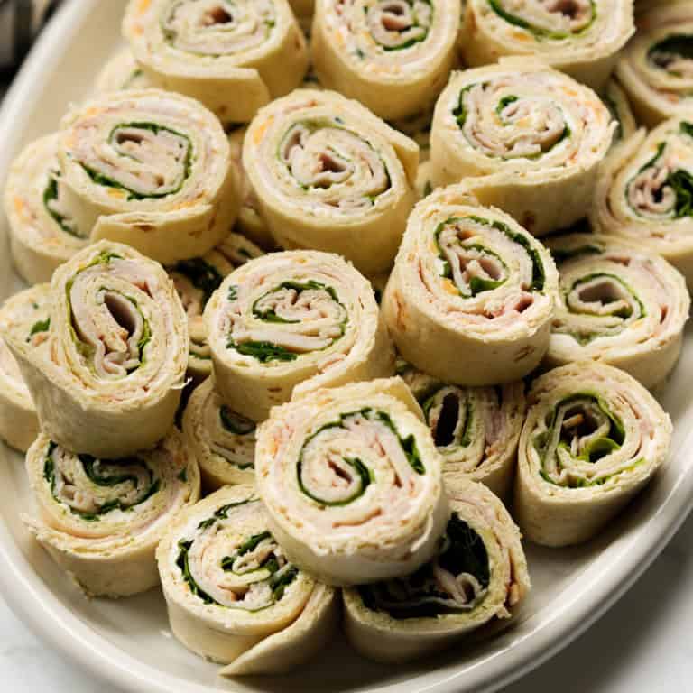 A stack of turkey and cheese pinwheels
