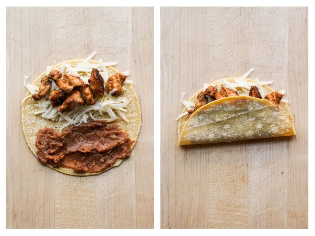 Adding refried beans to tortilla and then closing up the tortillas