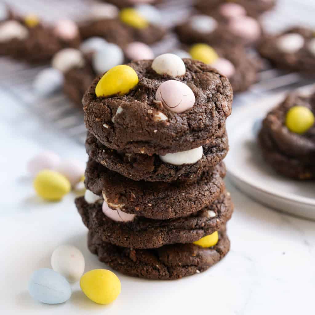 A close up picture of chocolate cookies with Cadbury mini eggs baked in them.