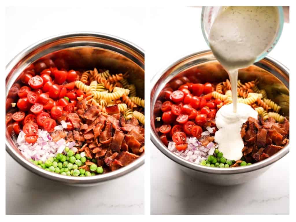 Ranch dressing is poured into a mixing bowl filled with cooked pasta, peas, diced red onions, sliced cherry tomatoes, and chopped bacon.