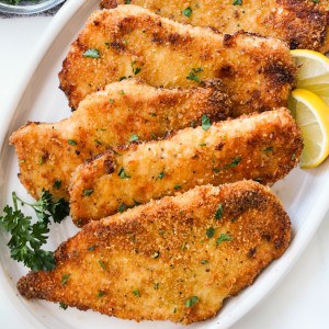 4-5 pieces of baked chicken cutlets that are crispy and golden brown