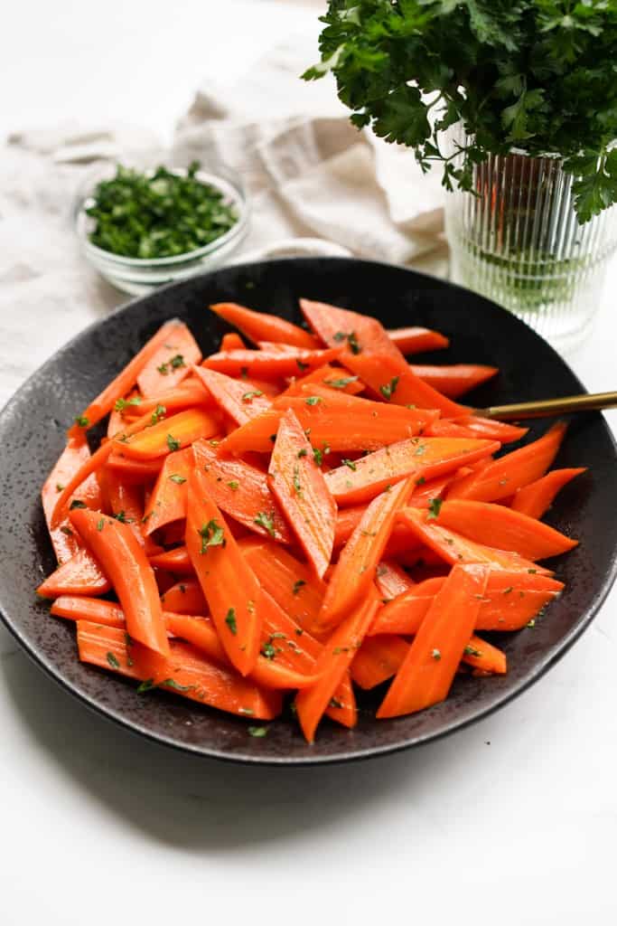 A large bowl of candied carrots