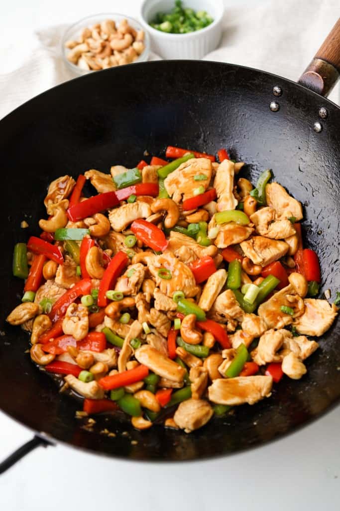 Cashew Chicken is in a wok just after it finished cooking.