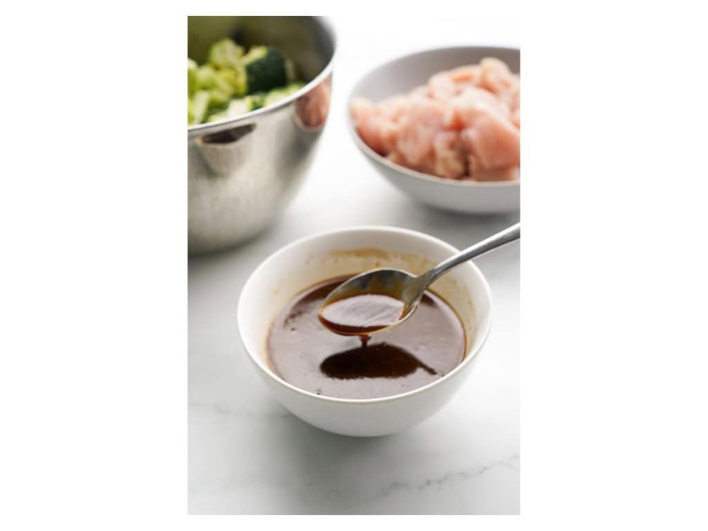 Sauce ingredients are added to a small bowl and mixed together.