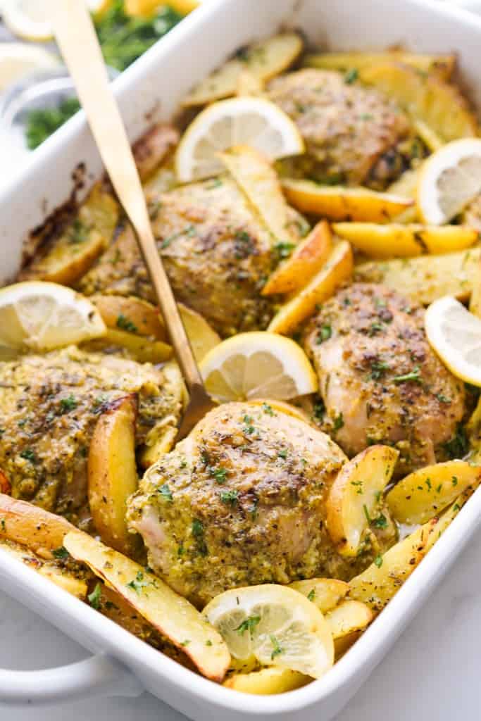 Plumb chicken thighs and sliced potatoes were baked with a lovely Greek Lemon marinate.