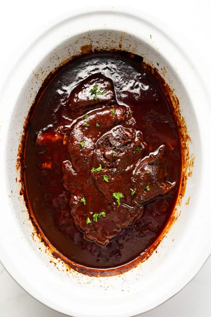 BBQ Pot Roast has finished cooking inside the slow cooker.