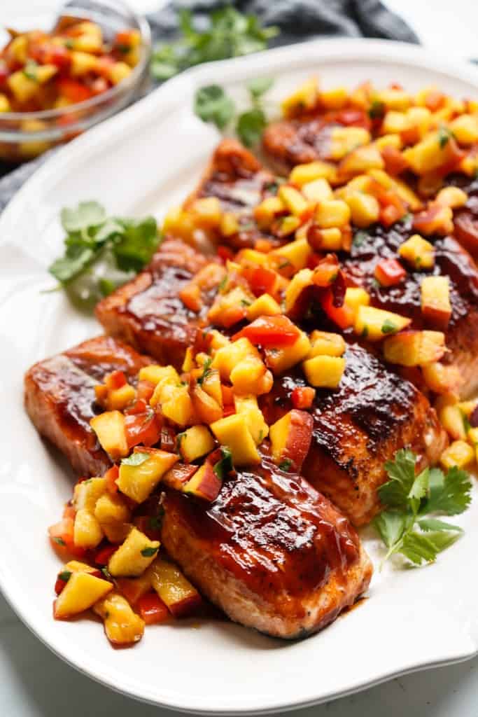 BBQ glazed salmon is topped with a delicious fresh peach salsa.