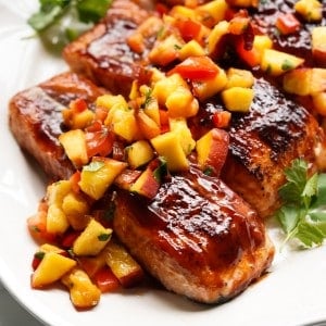 BBQ glazed salmon is topped with a chunky peach salsa.