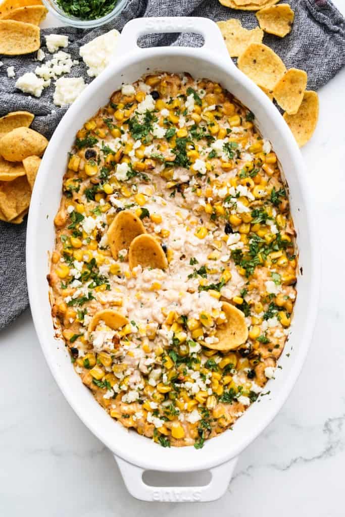 Cheese street corn dip is fresh out the oven and ready to eat.