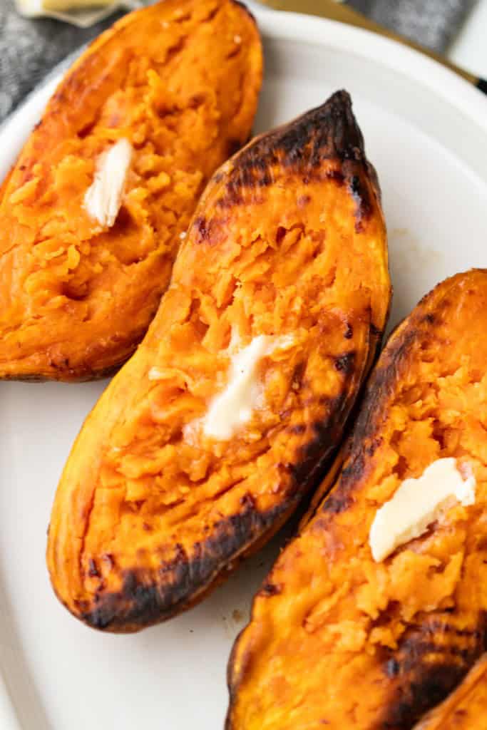 Oven roasted sweet potatoes have been caramelized in the oven.