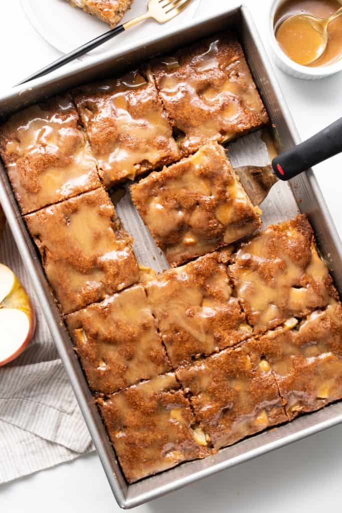 Caramel Apple Dump Cake is cut into pieces and ready to eat.