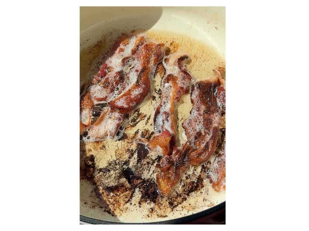 bacon cooking in a dutch oven