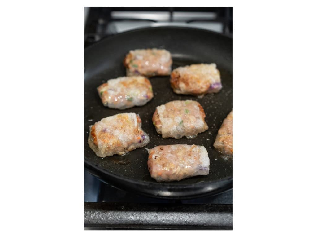 Rice paper dumplings are cooked in a skillet until filling is cooked through and rice paper is crispy.