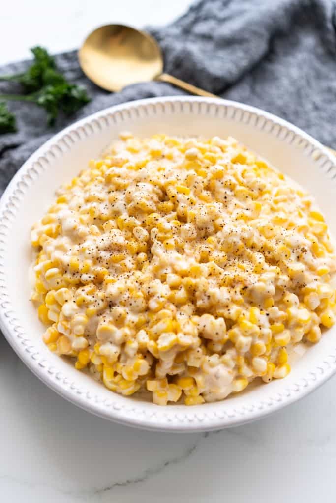 A bowl is filled with creamy crockpot corn.