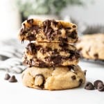 Gooey chocolate chips are seen in the center of this super thick chocolate chip cookie.